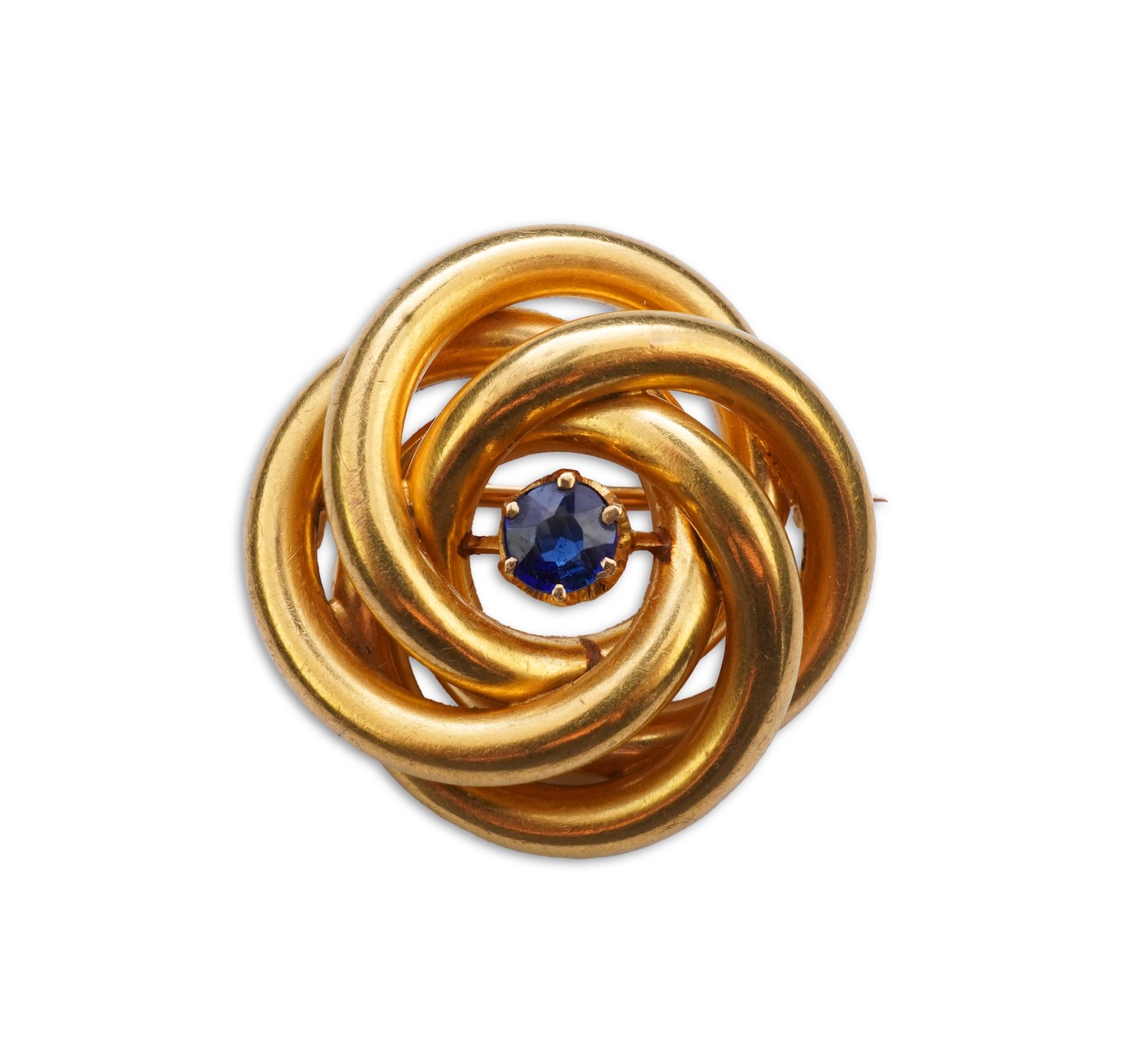 A gold and sapphire knot brooch, France, late 19th century